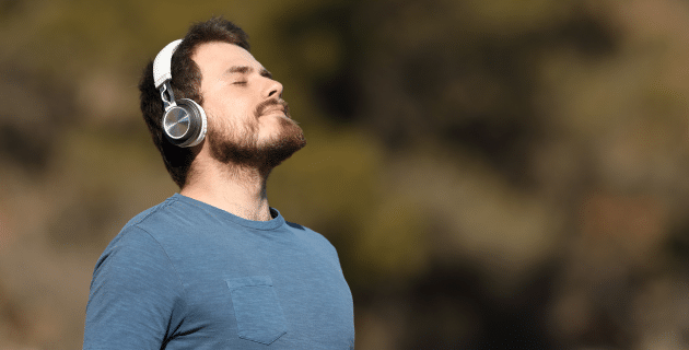 man outdoors with headphones on