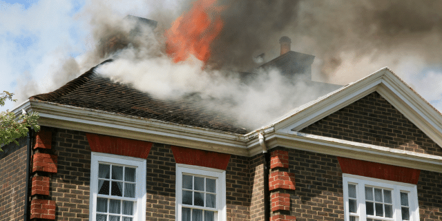 an image of a fire on the roof of a home