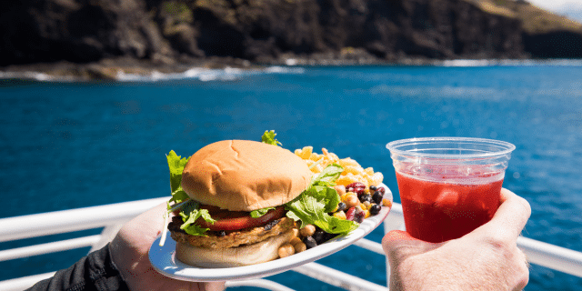 an image of a person on a boat holding snacks