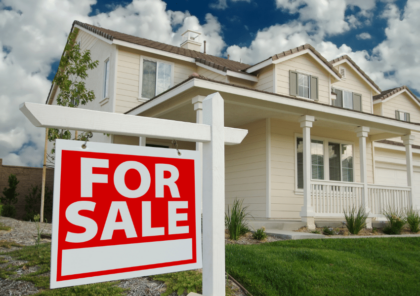 an image of a home with a for sale sign in front