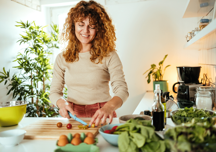 an image of a woman making a salad